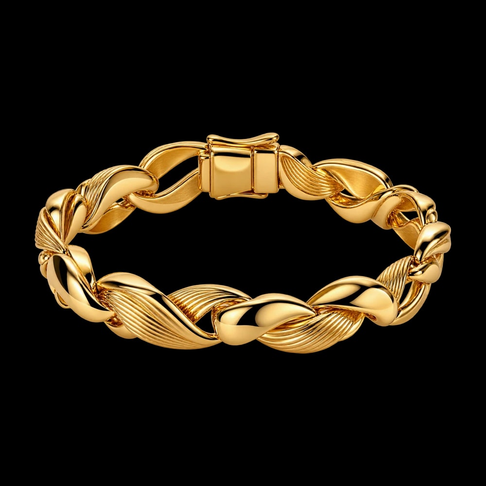 A gold bracelet of polished and fluted links twisting into one another